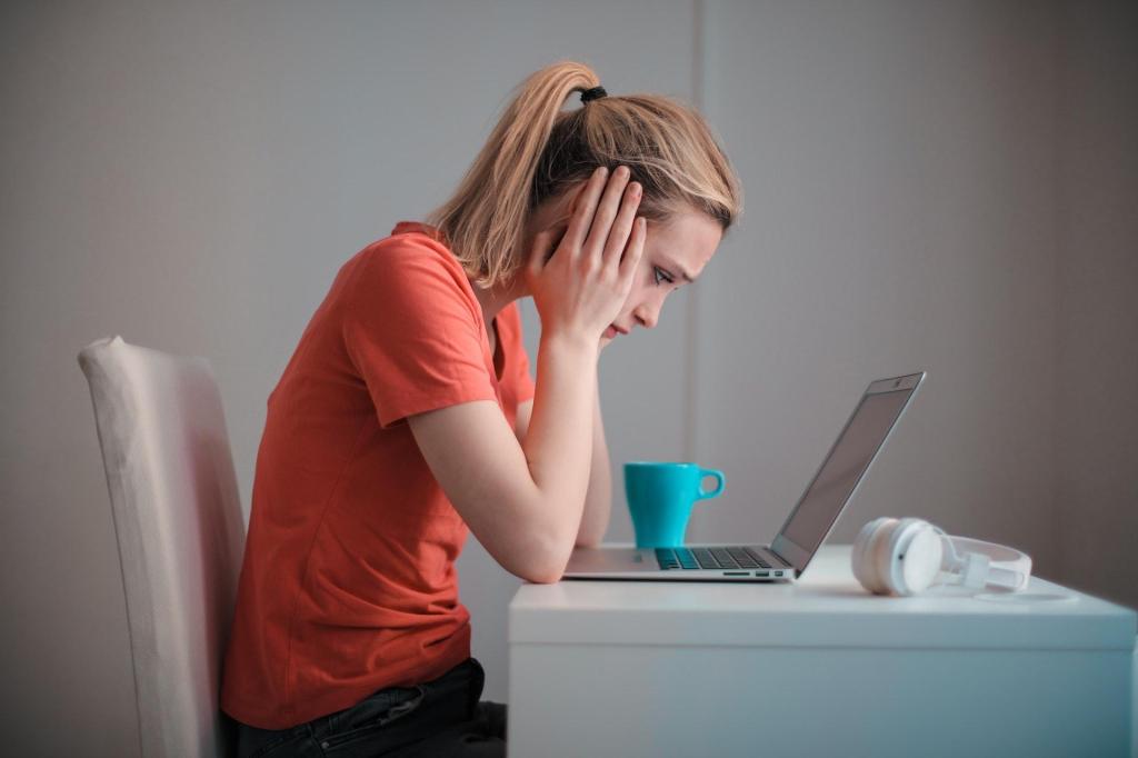 woman looking stressed at pc, to show the pressures of learning a new skill